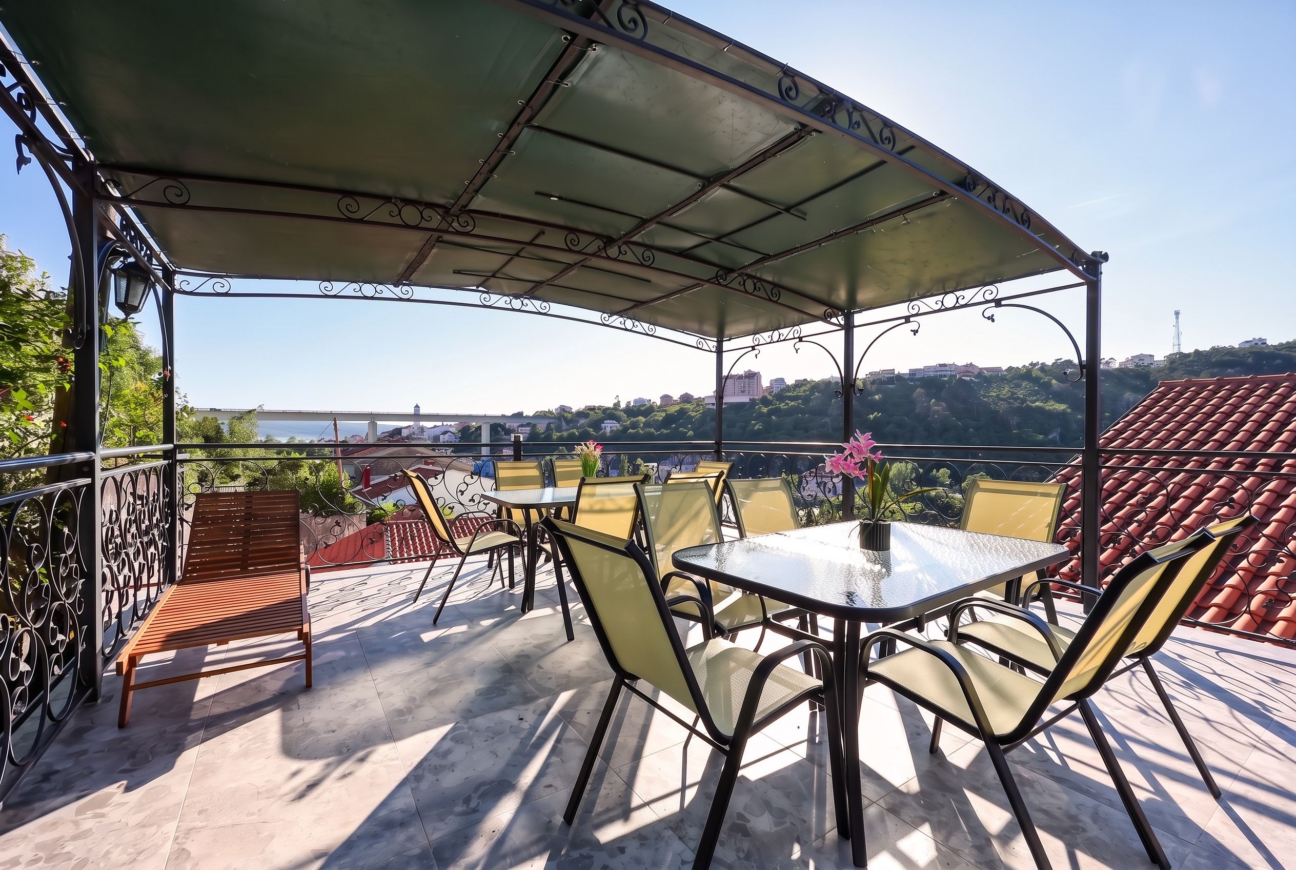 The shared roof terrace at Apartments Gloria, looking over Crikvenica to the bay